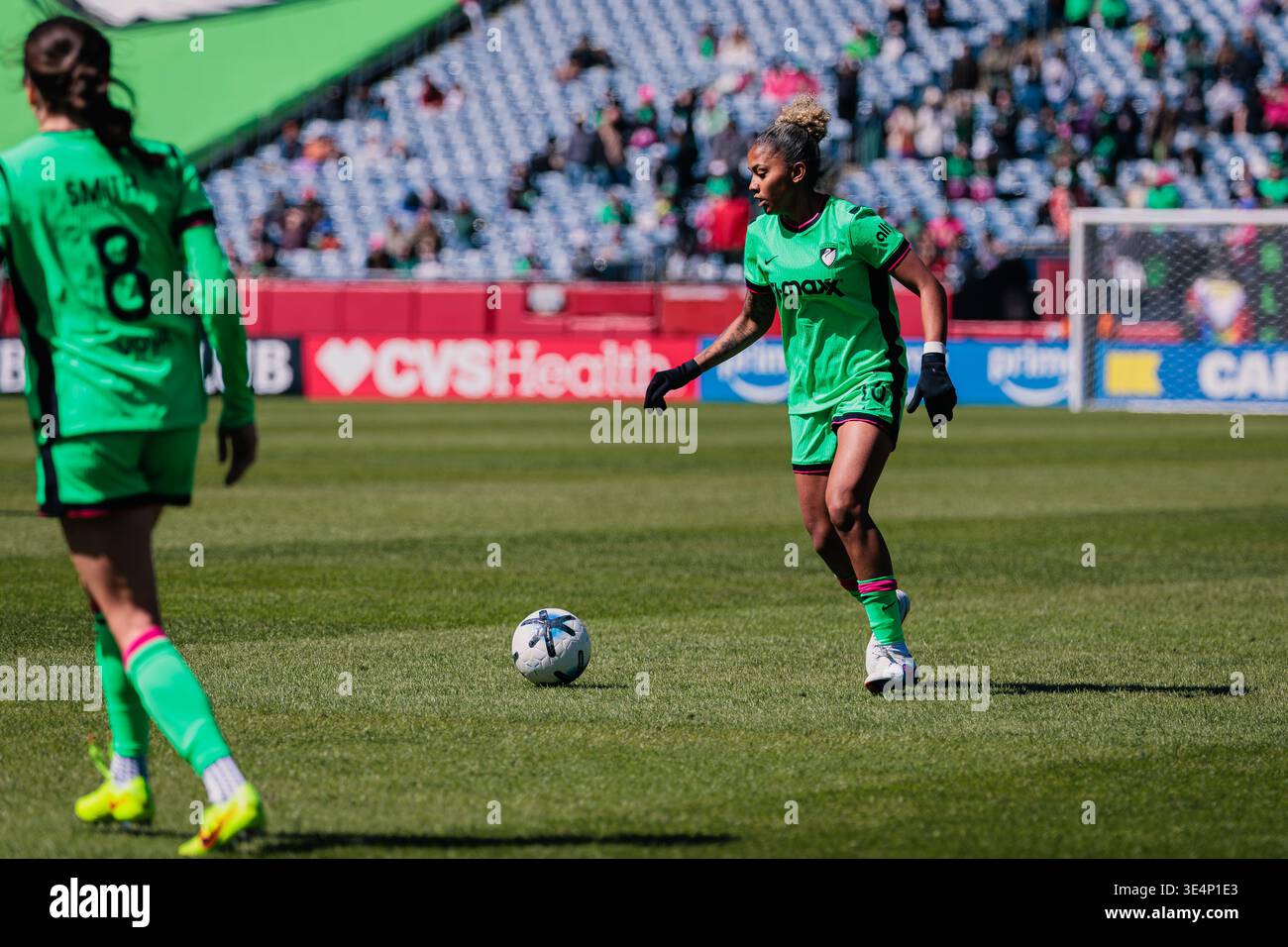 Aïssata Traoré (Boston Legacy FC) dribbles the ball during a NWSL match at Gillette Stadium. Another Boston Legacy FC player is nearby. Stock Photo