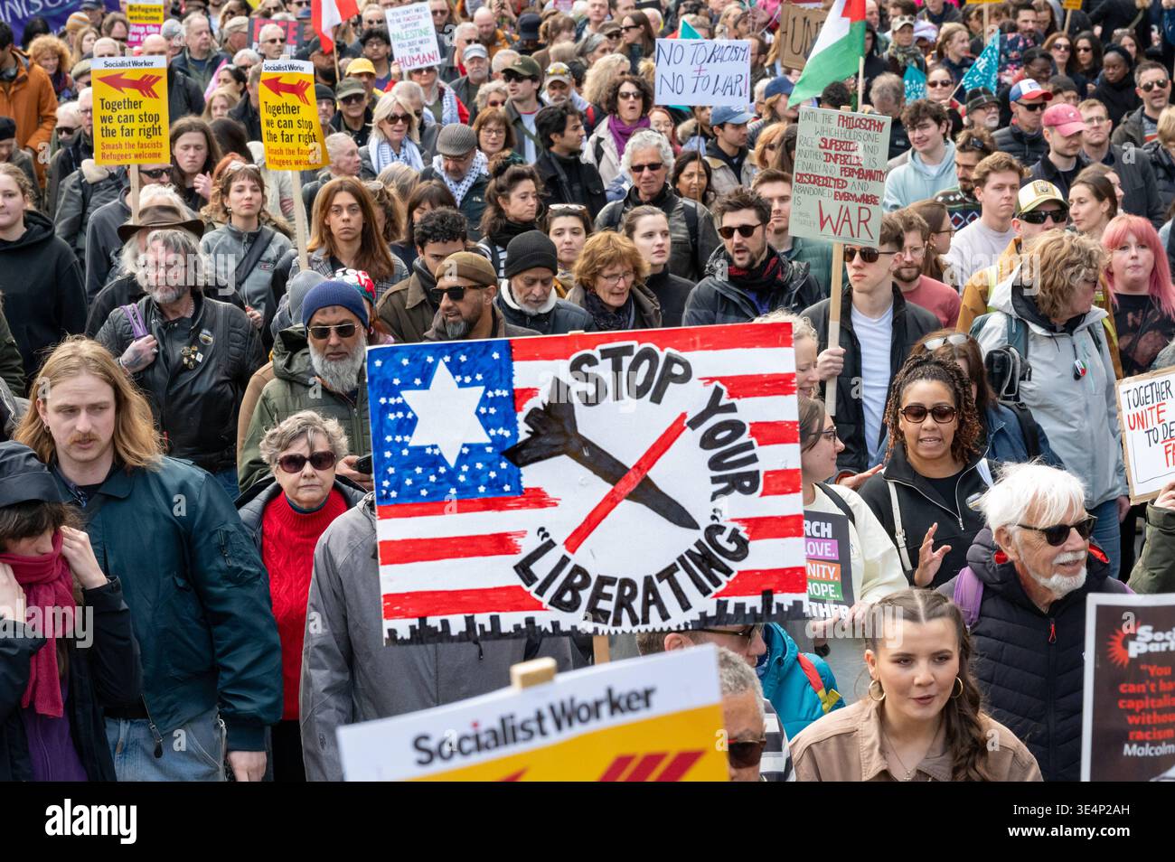 Large crowd marches toward Downing Street. Protesters attend a march ...