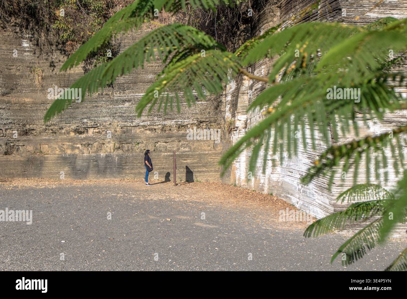 Itu, Sao Paulo, Brazil, July 26, 2018. Woman on the Varvito Geological Park, featuring layered sedimentary rocks formed during ancient glacial periods Stock Photo