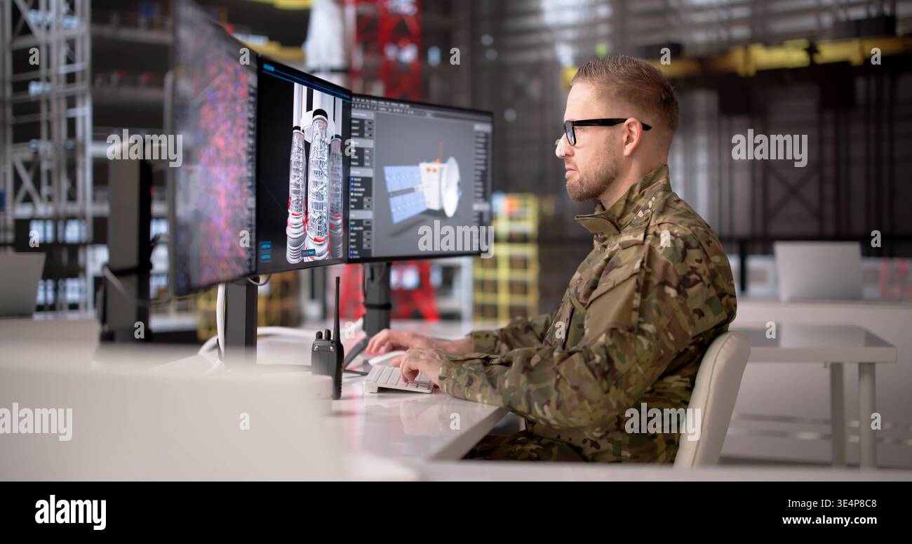 Young Rocket Engineer Analyzes Industrial Computer Systems At A Modern Workstation Stock Photo