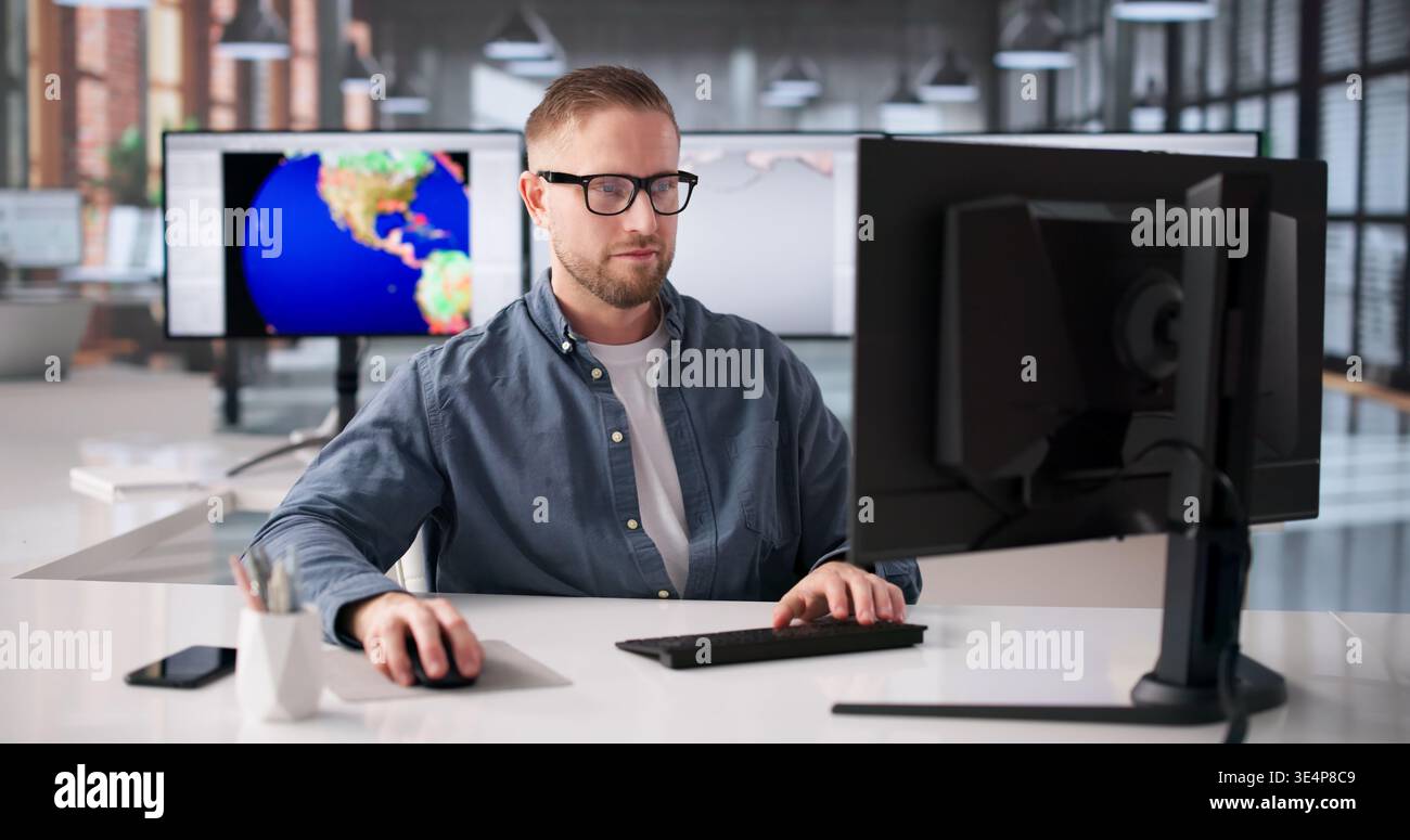 Meteorologist Analyzes Climate Data On Computer To Track Weather Changes Stock Photo