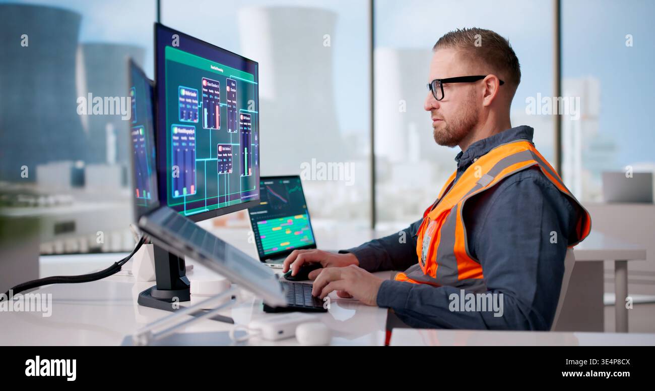Engineer Diligently Oversees SCADA Network Managing Nuclear Power Facility Operations Stock Photo