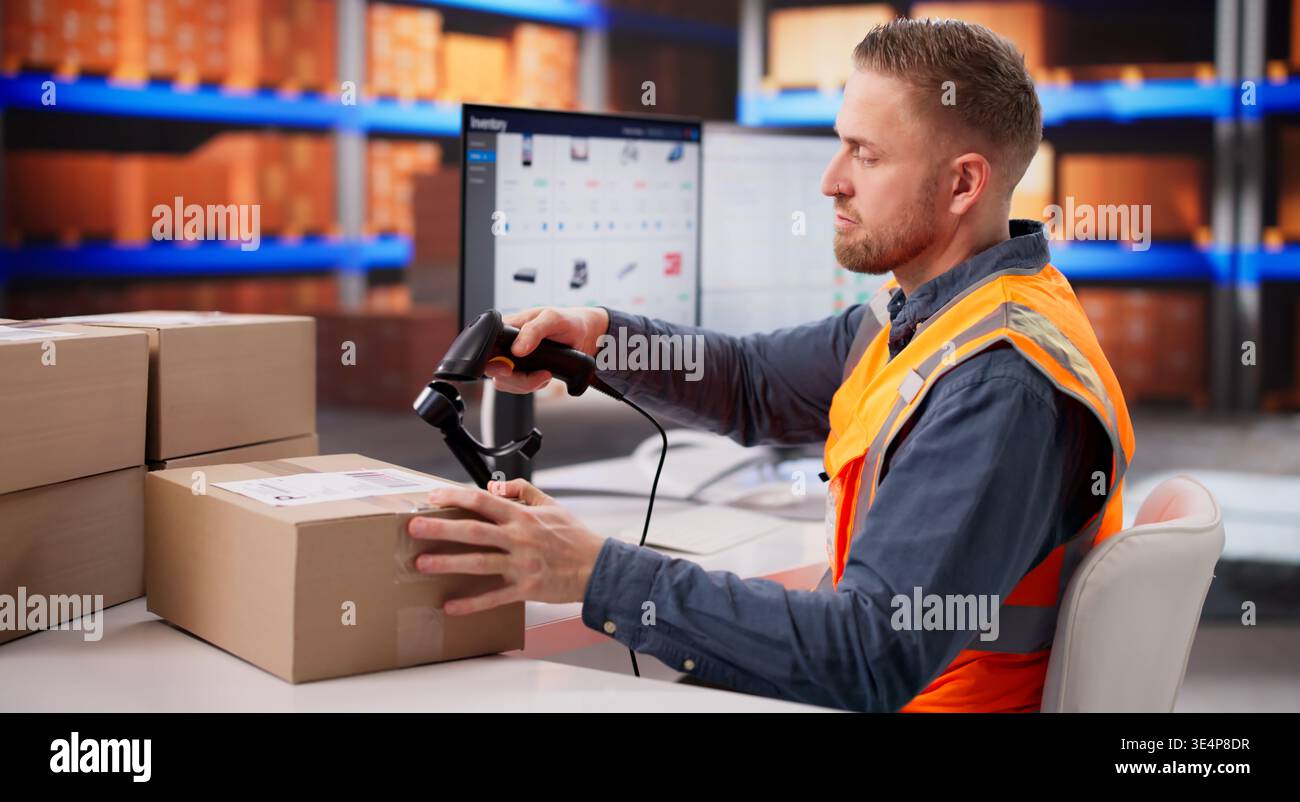 Warehouse Employee Checking Barcode Tags On Boxes For Stock Management Stock Photo