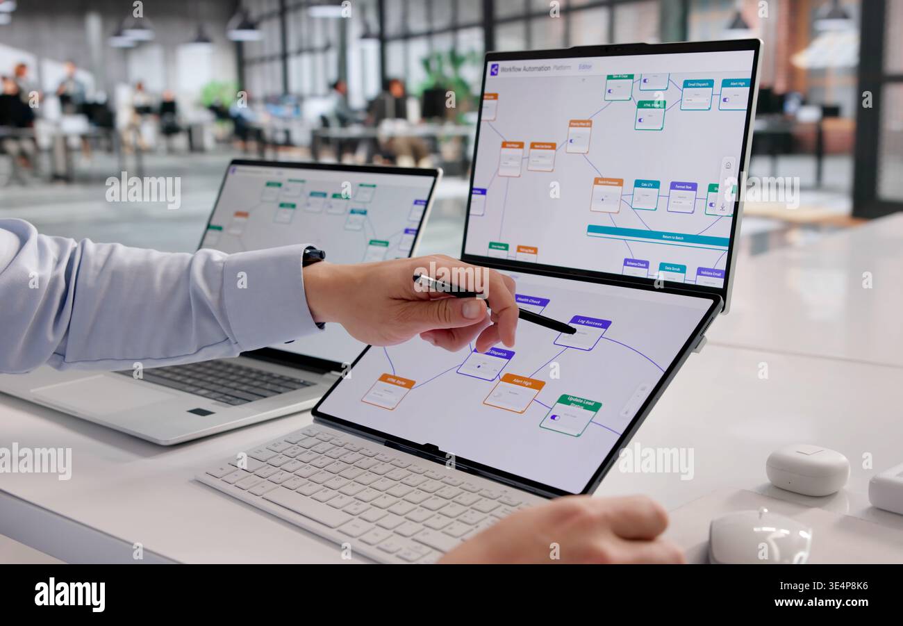 Hispanic Professional Enhances Business Process Automation Using Laptop Technology Stock Photo