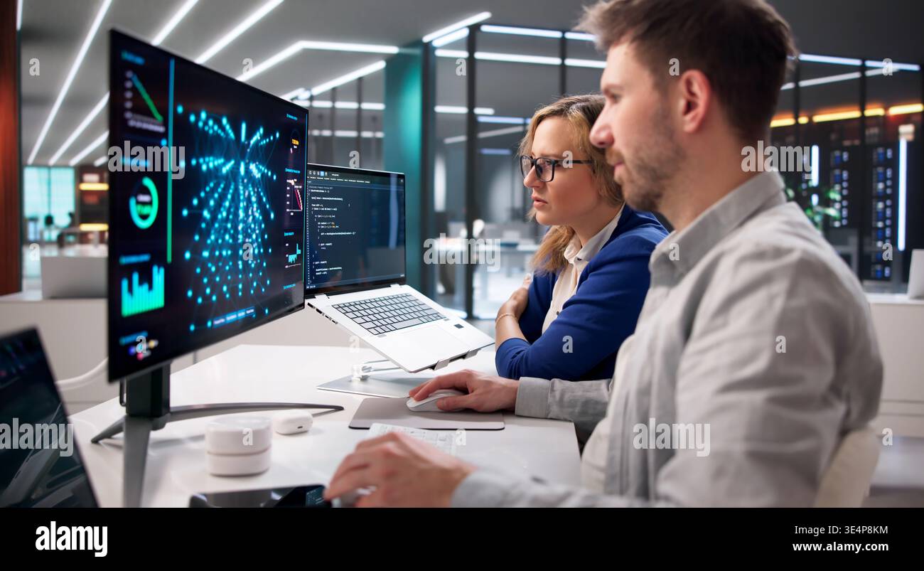 AI Specialist Oversees Real-Time Server Inference Operations In Data Center Environment Using Laptops Stock Photo