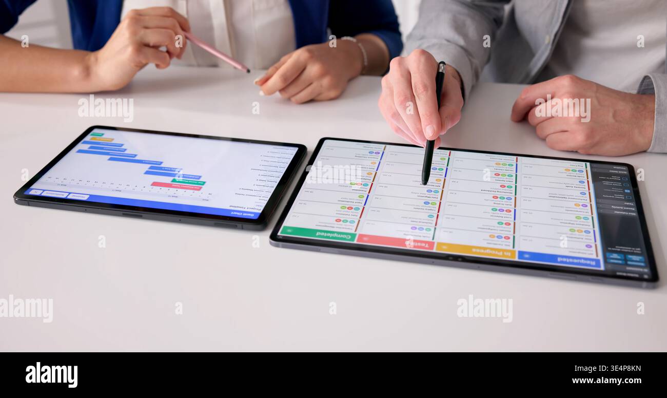Project Manager Evaluates Schedule And Updates Event Planning Gantt Chart Stock Photo