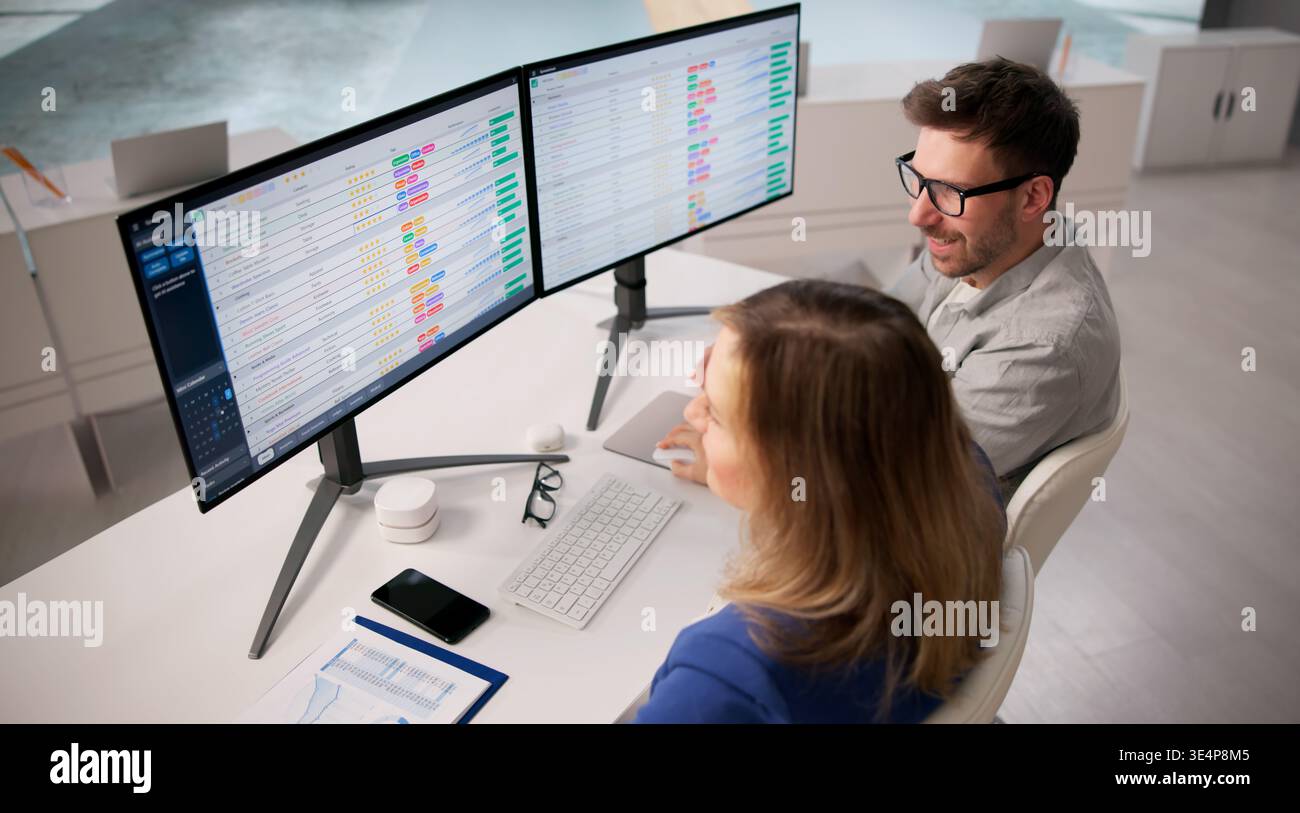 Analyzing Healthcare Information On Computers In A Training Workshop Stock Photo