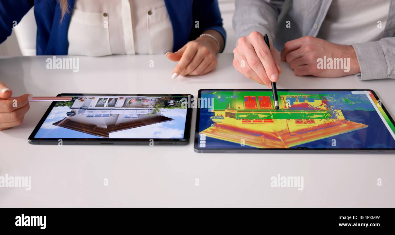Energy Efficiency Expert Analyzes Home Insulation With Thermal Imaging Camera Outdoors Stock Photo
