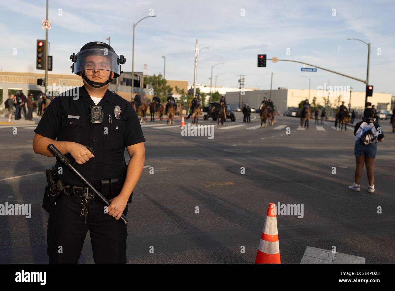 Pd Baton A police officer holding his baton stands at the ready outside the ...