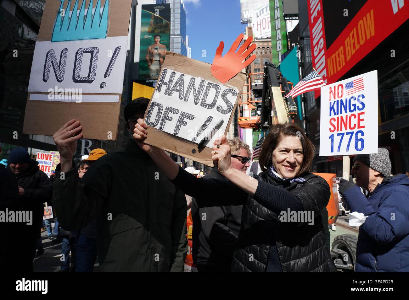 Tens of Thousands of people marched, carrying signs expressing their ...
