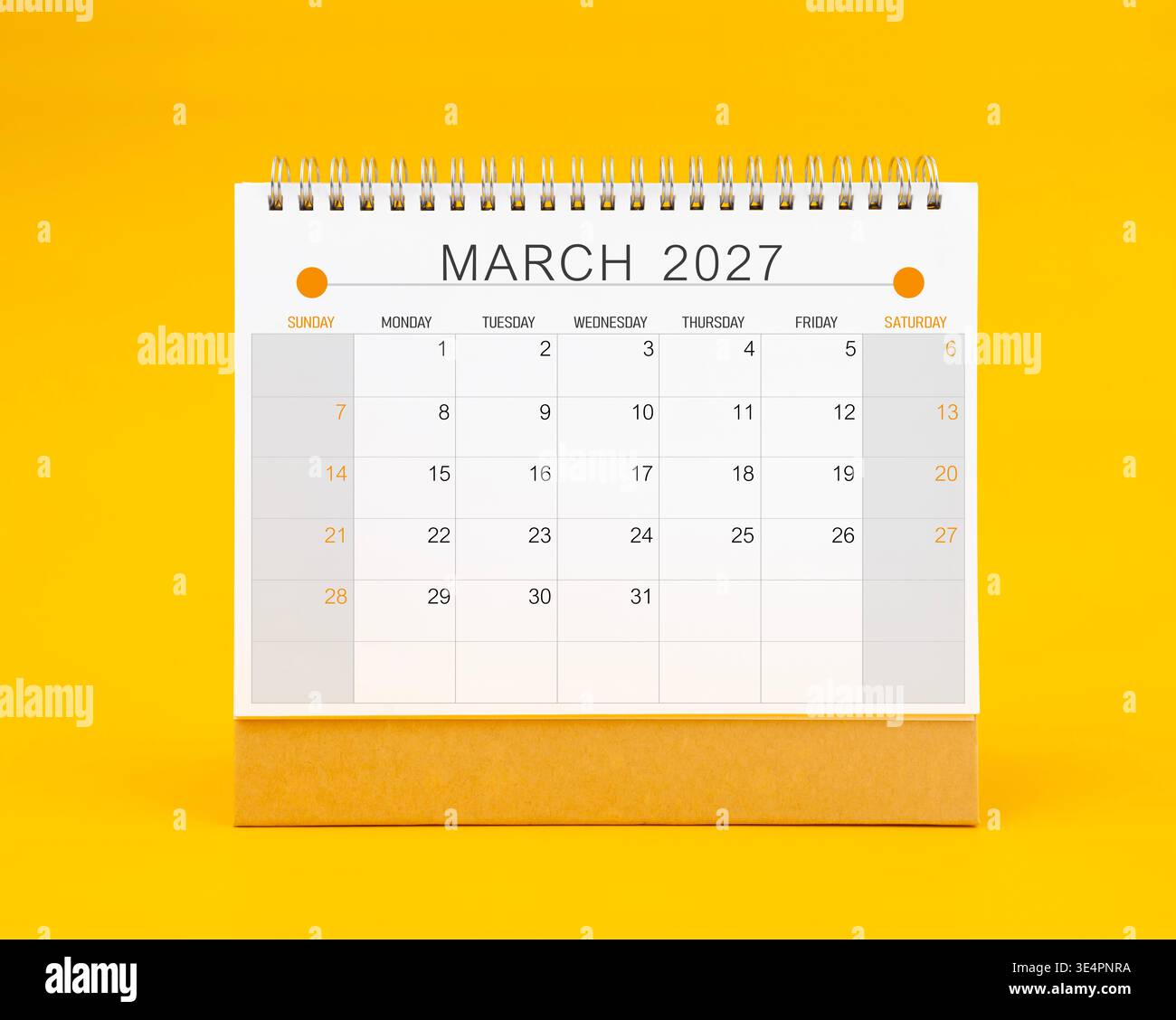 March 2027 desk calendar on yellow background, Front view Stock Photo - Alamy