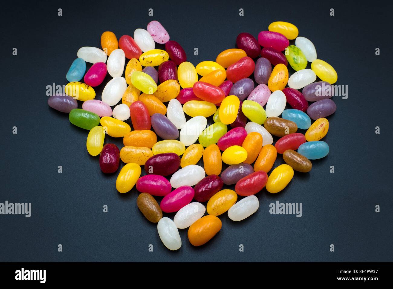 Jelly beans, colorful sweet heart-shaped candies. Stock Photo