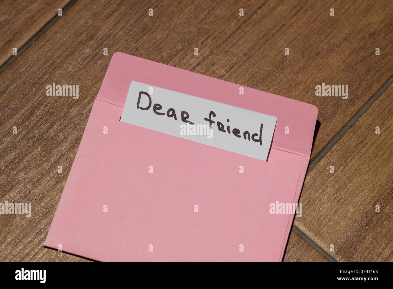 Pink Pastel Message A personal message written by hand on a small card is partially visible ...