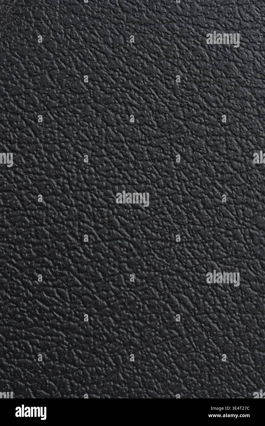 Black plastic texture with leather pattern macro close up view Stock Photo