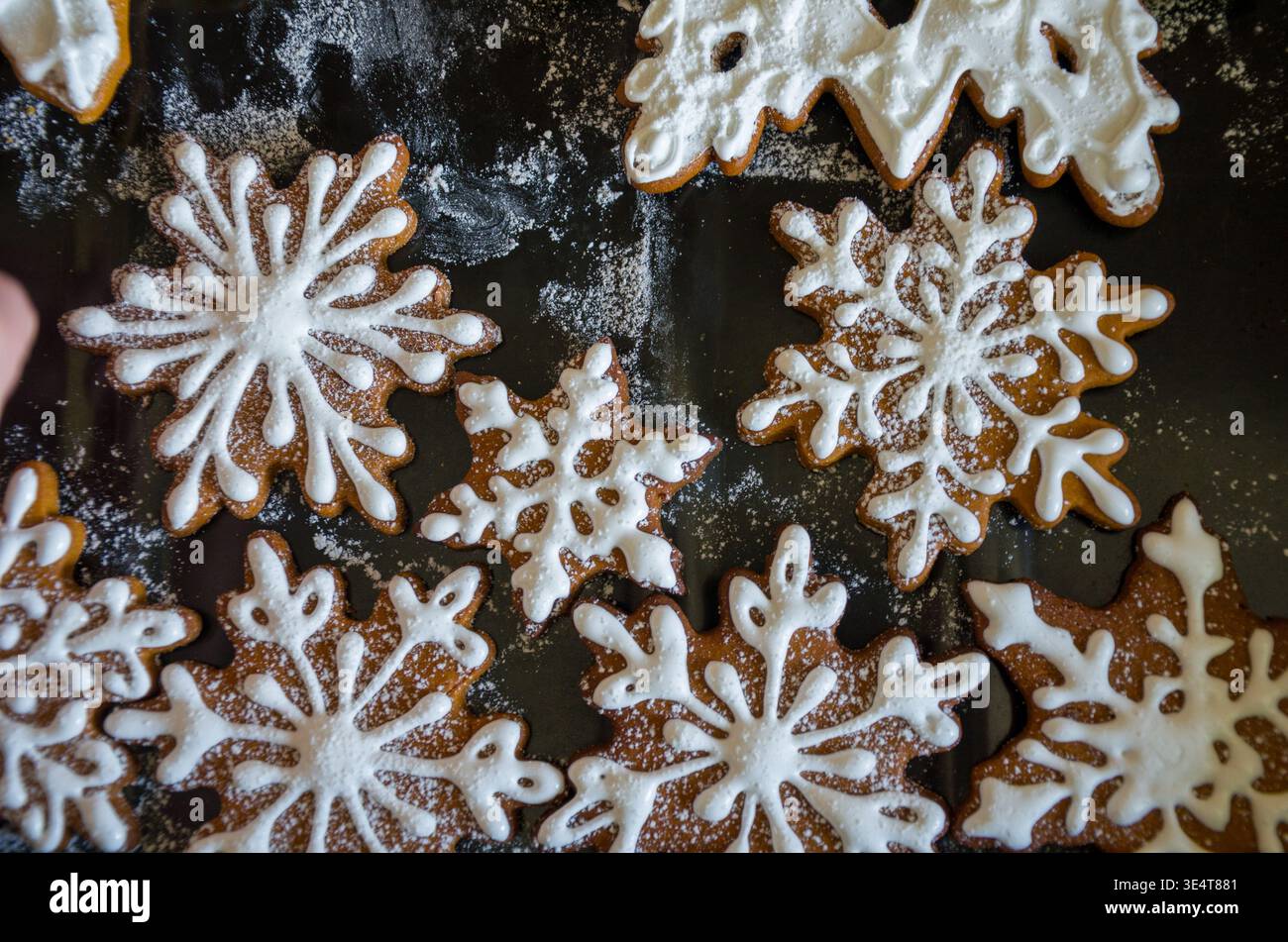Decorated Snowflake Gingerbread Cookies on Baking Sheet Stock Photo