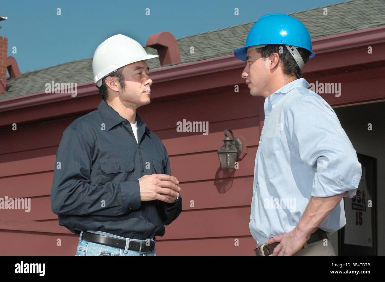 Engineering contactor supervisor with blueprints plans, USA Stock Photo