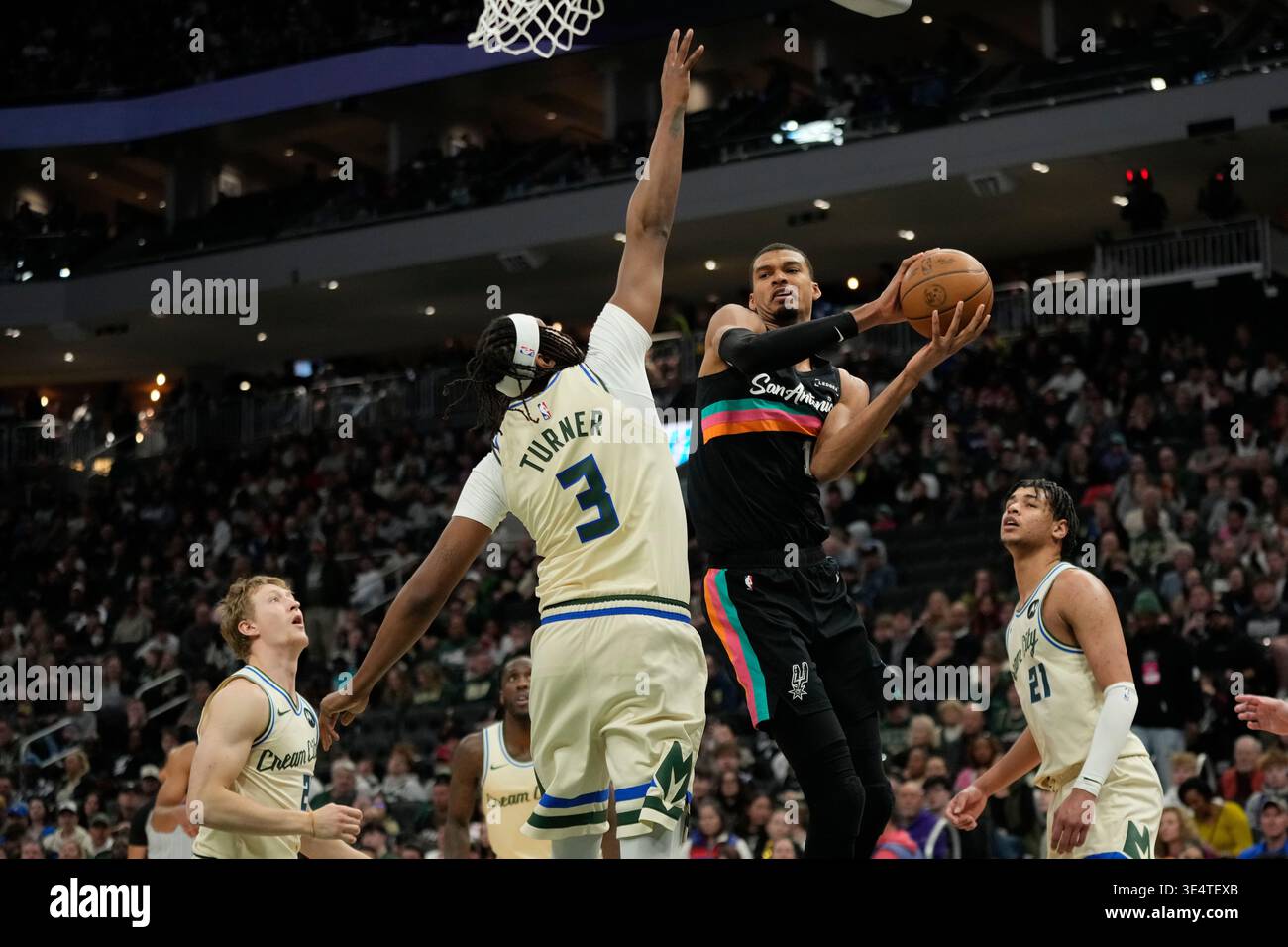 San antonio spurs victor wembanyama passes the ball around milwaukee bucks myles turner during an nba basketball game saturda San antonio spurs victor wembanyama passes the ball around milwaukee bucks myles turner during an nba basketball game saturda