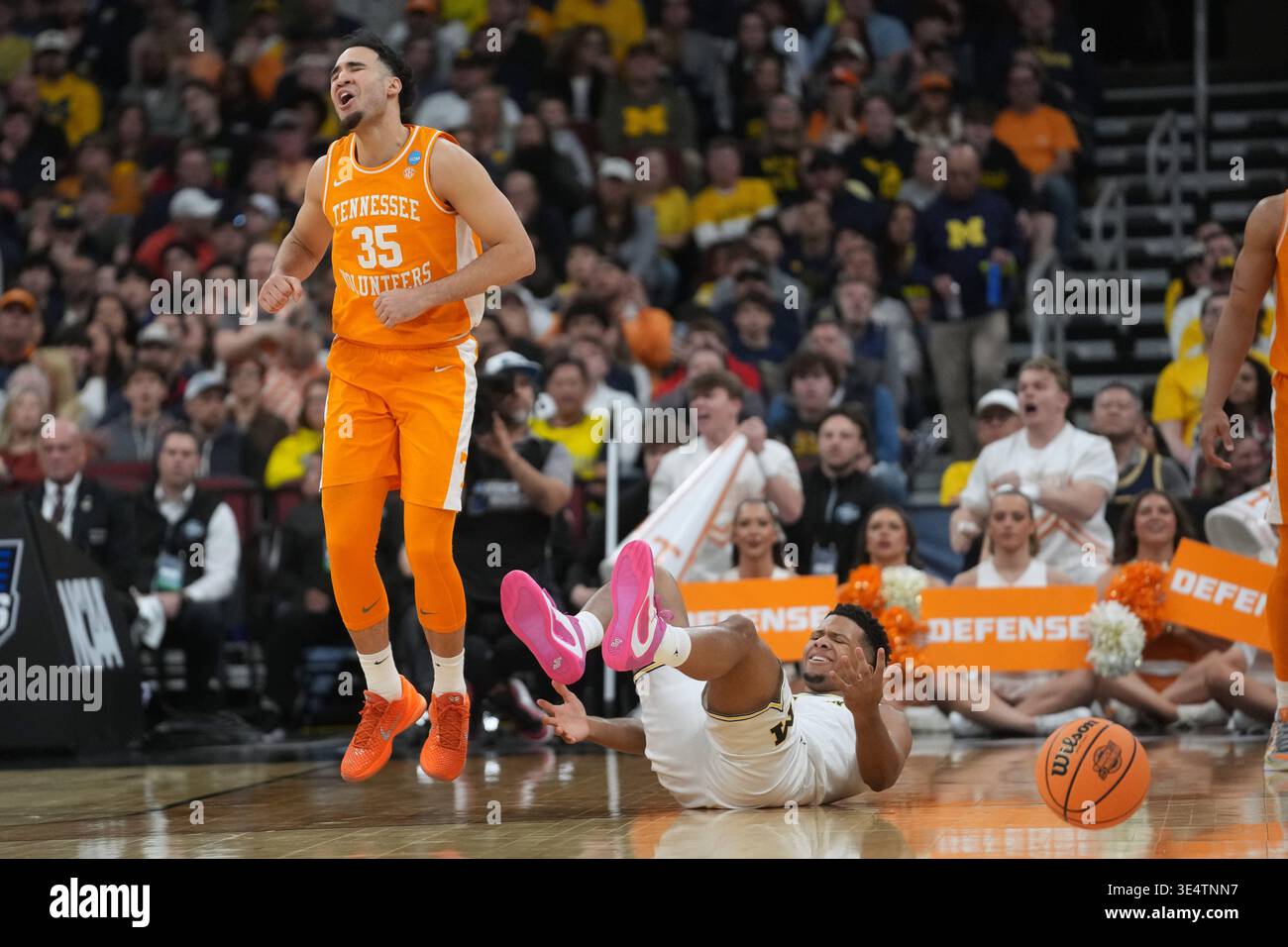 Tennessee's Ethan Burg (35) and Michigan's Trey McKenney react during ...