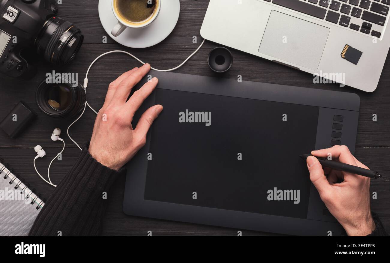 Designer hand with graphic tablet and keyboard Stock Photo