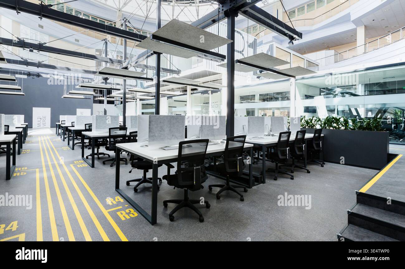 Big rental office with wrapped computers, no workers Stock Photo