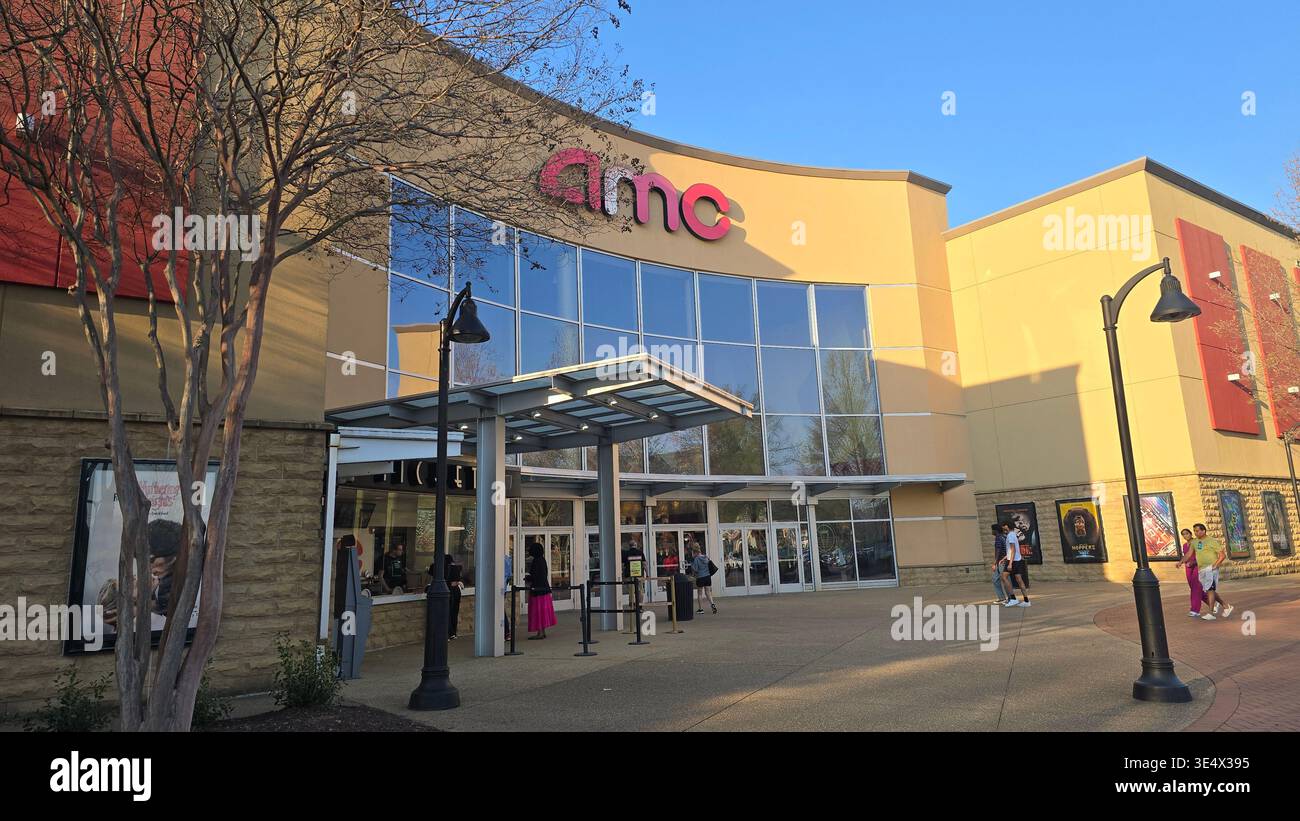 AMC movie theater entrance with visitors outside, modern cinema building in Georgia, USA - Smartphone Captured Stock Image