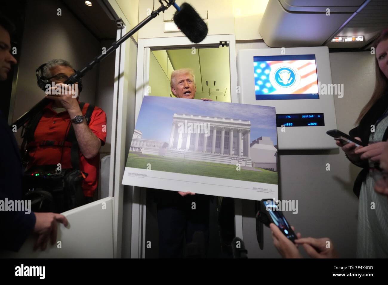 Reporters Rendering Stand In President Donald Trump holds a rendering of the proposed new East Wing ...