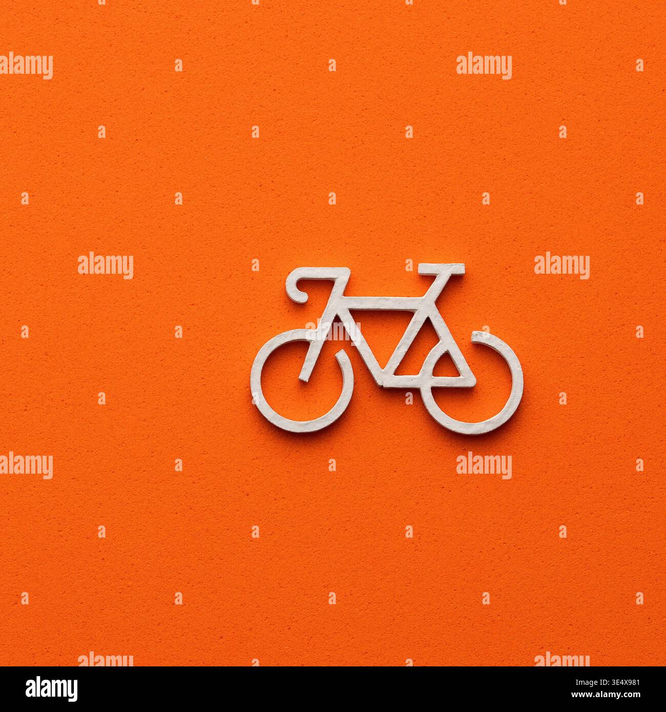 Minimalist bicycle icon in white on a vibrant orange background ...