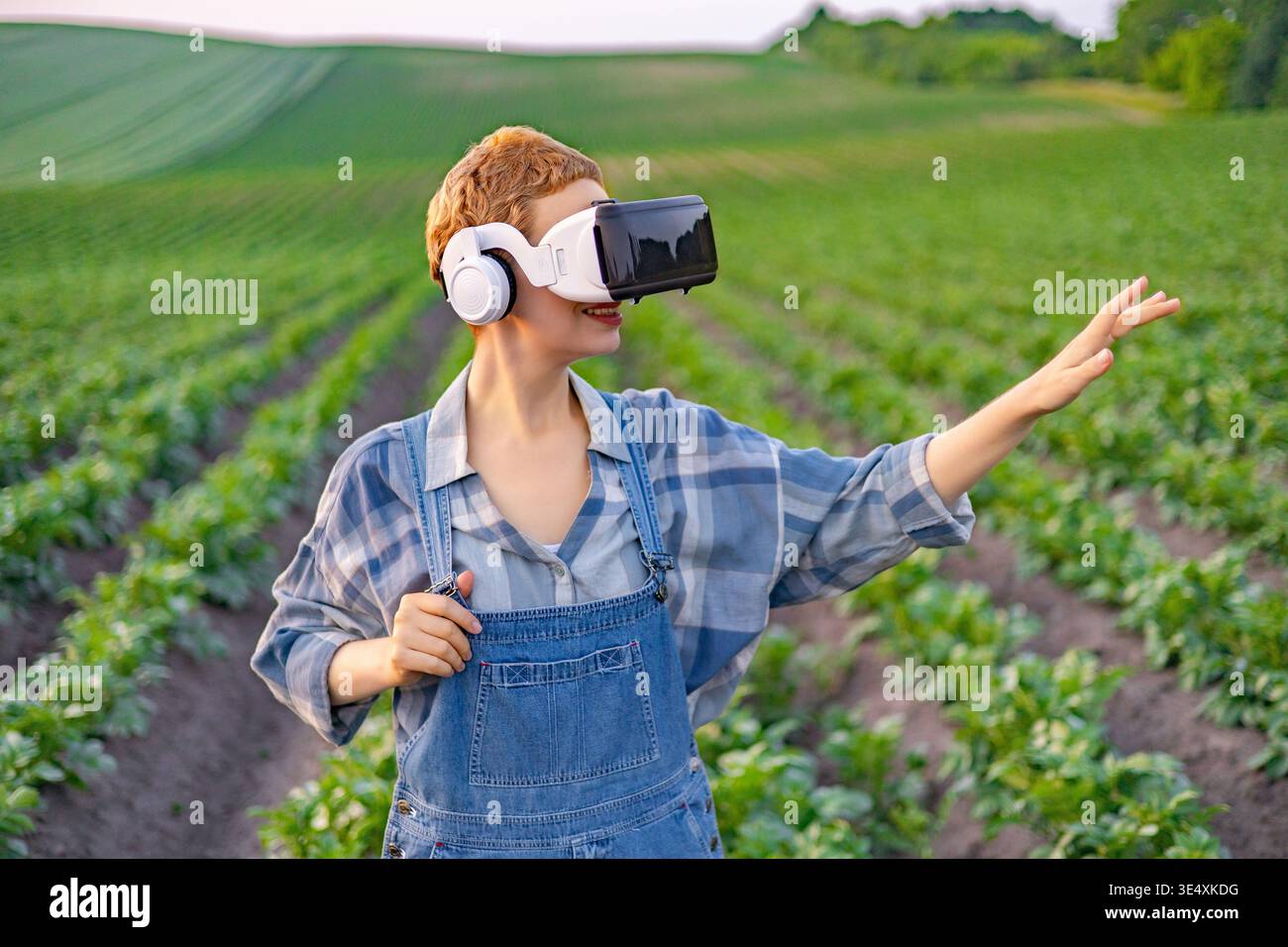 Farmer Using VR Headset in Field Stock Photo