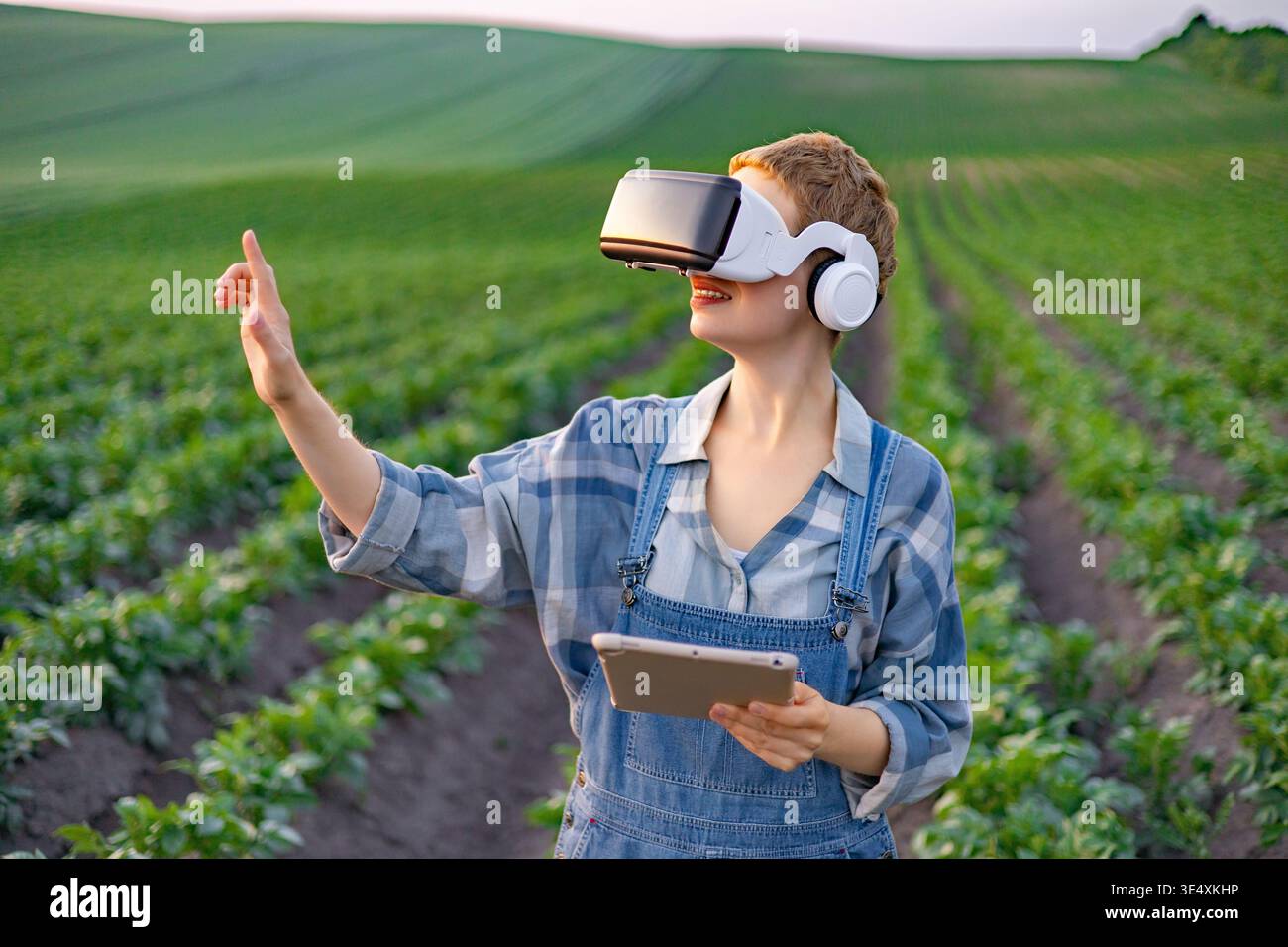 Farmer Using VR in Field Stock Photo