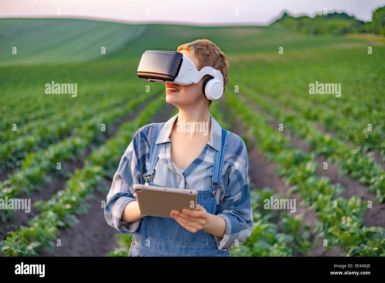 Farmer Using VR in Field Stock Photo