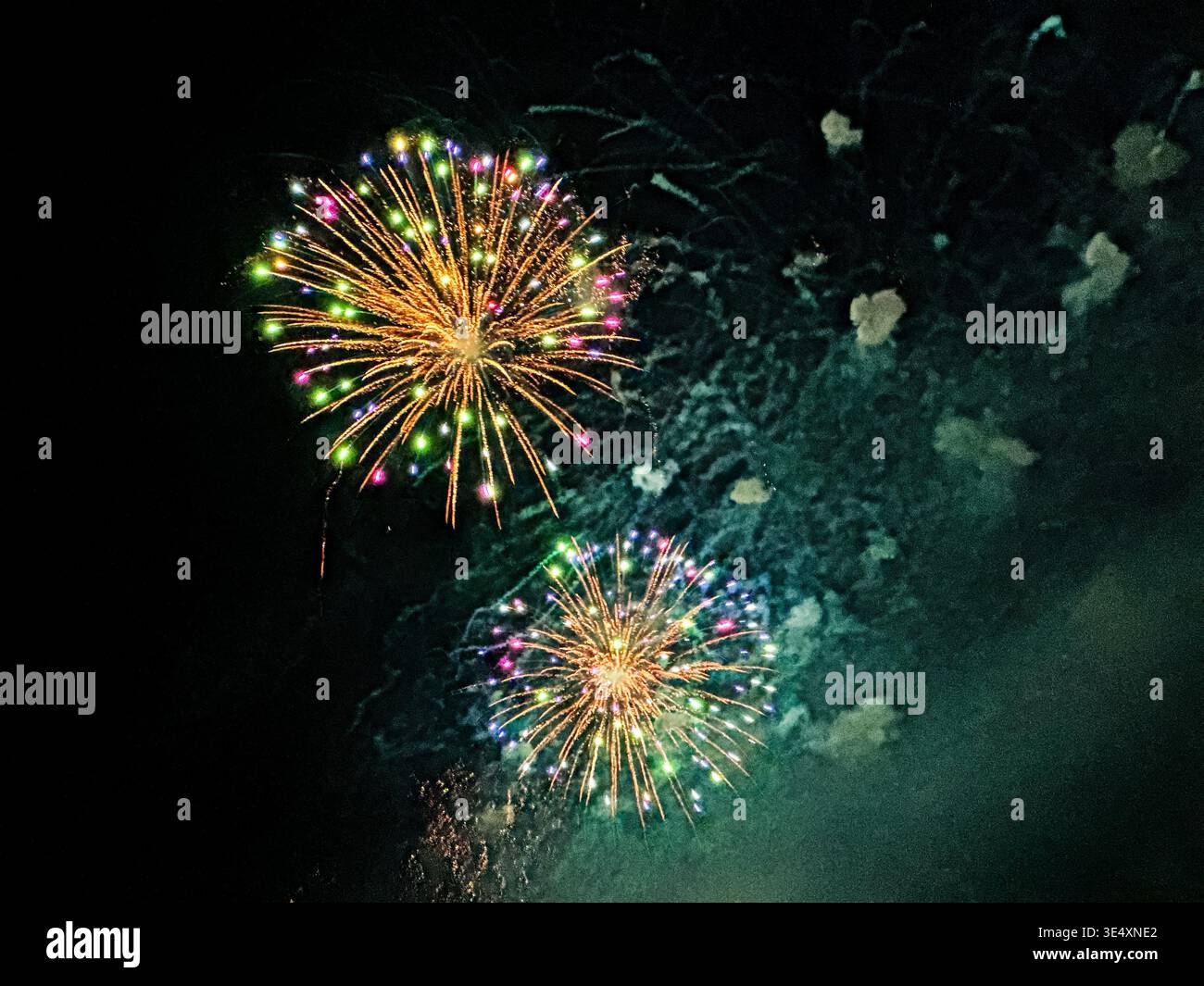 Two fireworks bombs explode over Lake Union in Seattle Stock Photo