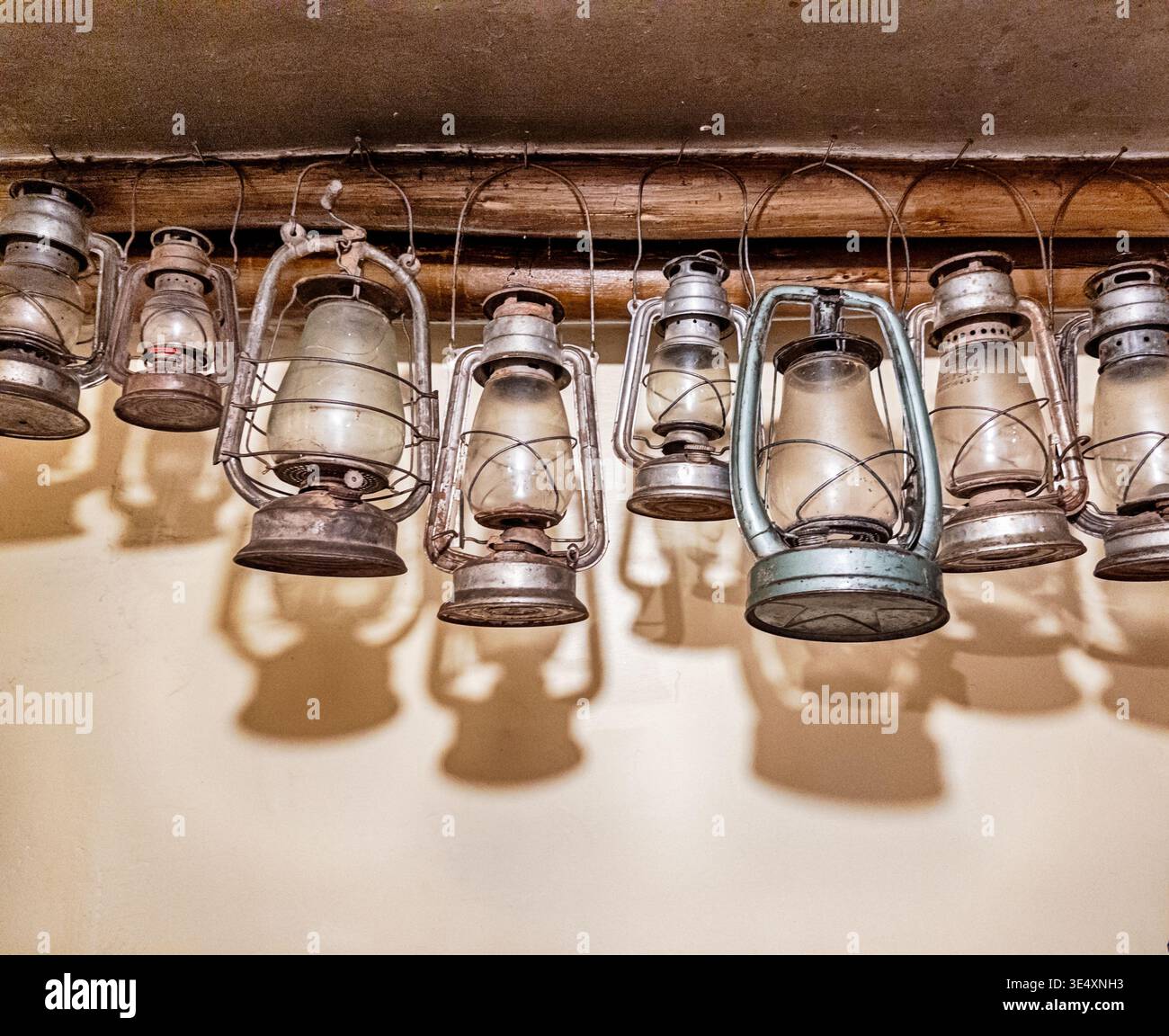 Still life of lanterns hang from the rafters inside a room of a shop in the town of Urubamba in Peru. Stock Photo