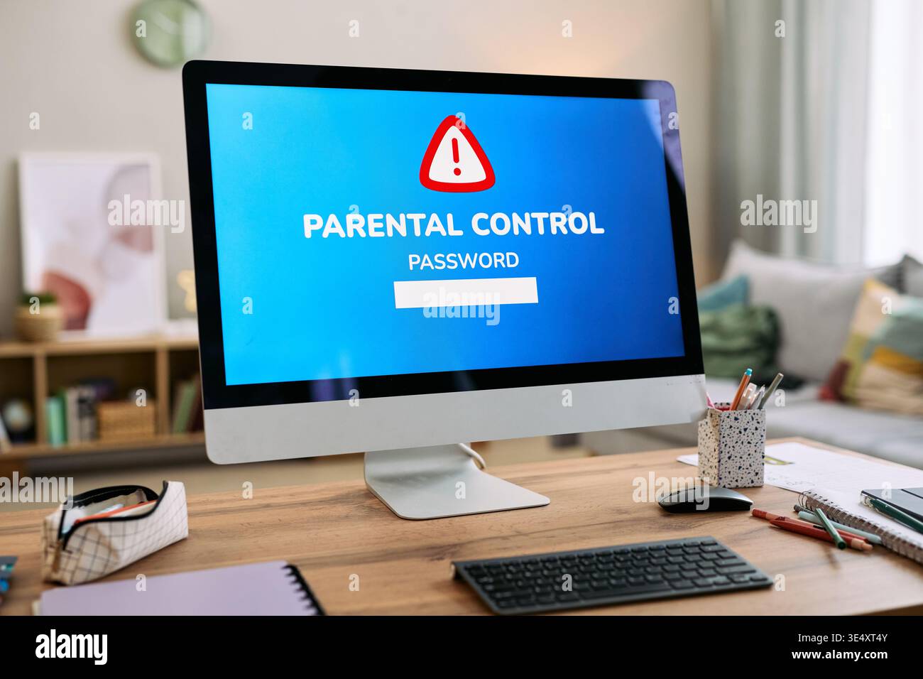 Modern desktop computer displaying parental control password warning on ...