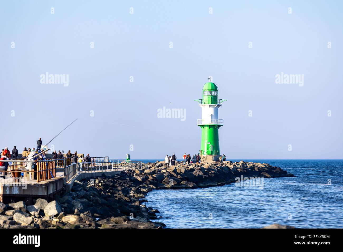 Green lighthouse on the seacoast in Warnemuende, Germany Stock Photo