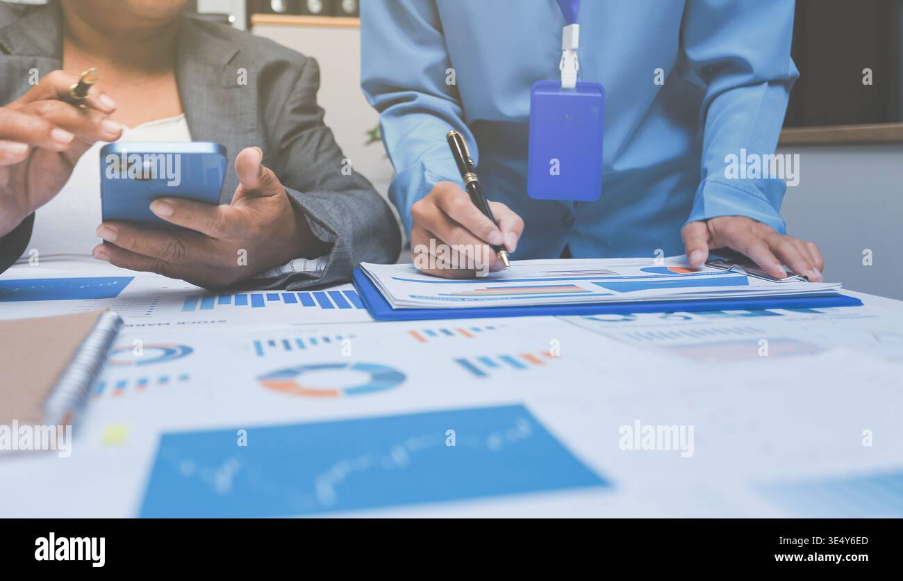 Auditor and accountant team working in office, analyze financial data ...