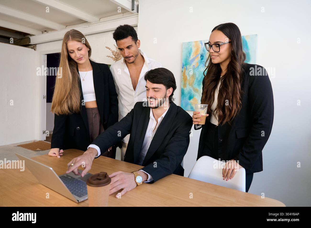 Diverse business team collaborating and discussing strategy Stock Photo