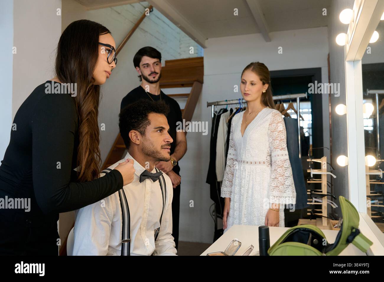 Bride and groom getting ready backstage for wedding Stock Photo