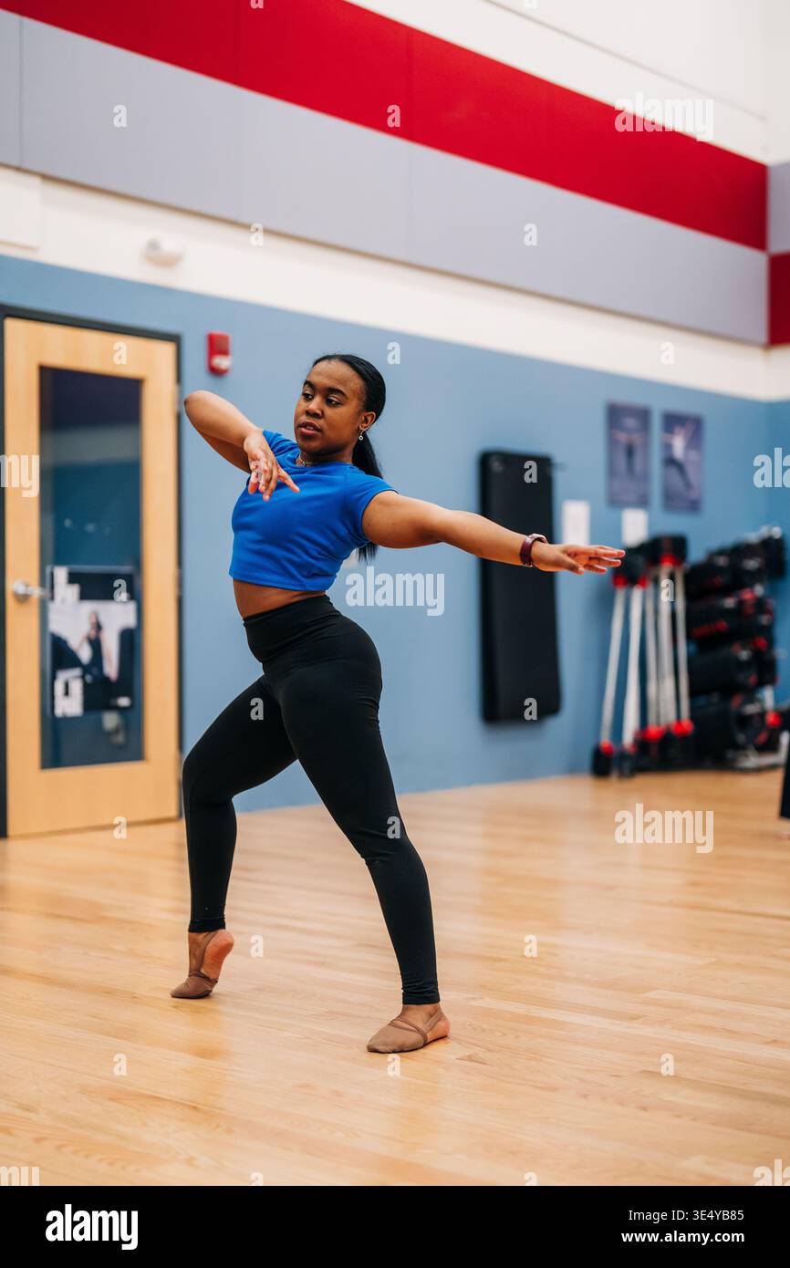 Female dancer practicing movement in studio rehearsal Stock Photo