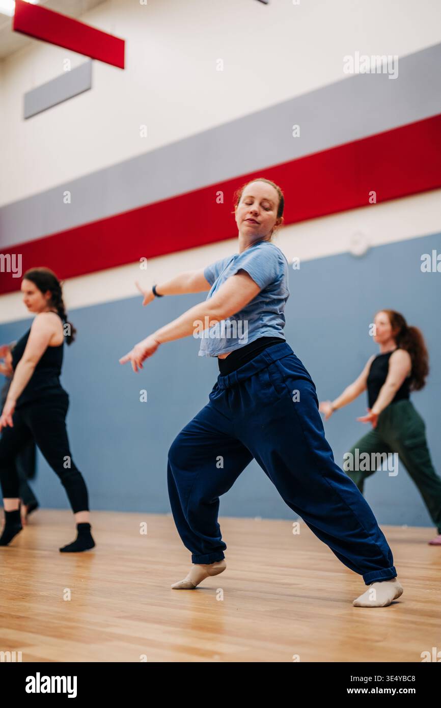 Female dancers practicing contemporary movement in studio class Stock Photo
