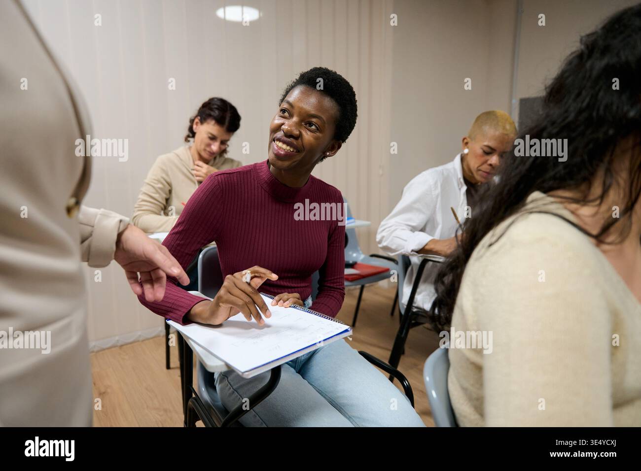 Students learning in a diverse classroom environment Stock Photo