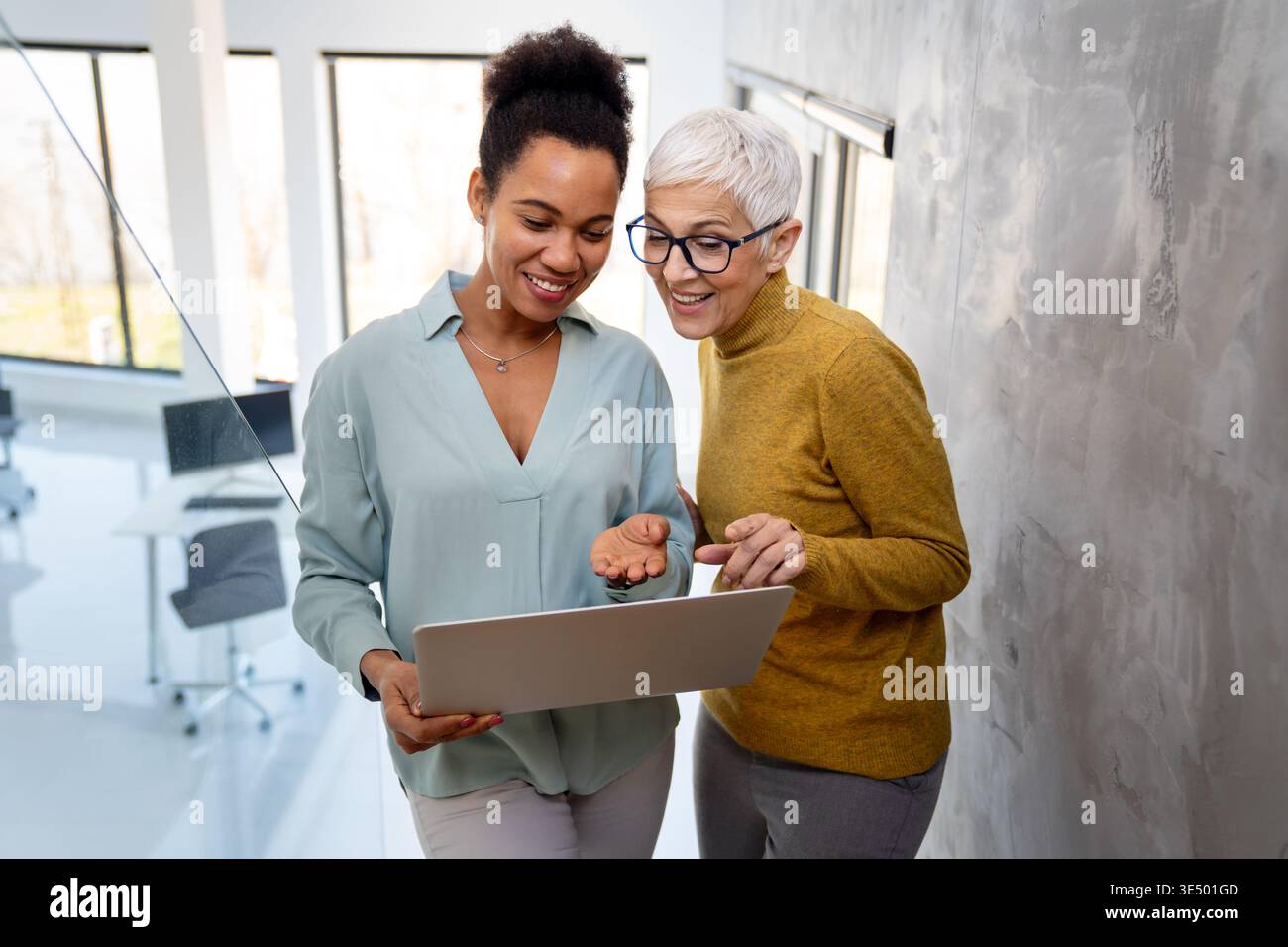 Mixed team of software engineers brainstorming ideas. Diverse app developers collaborating as group Stock Photo