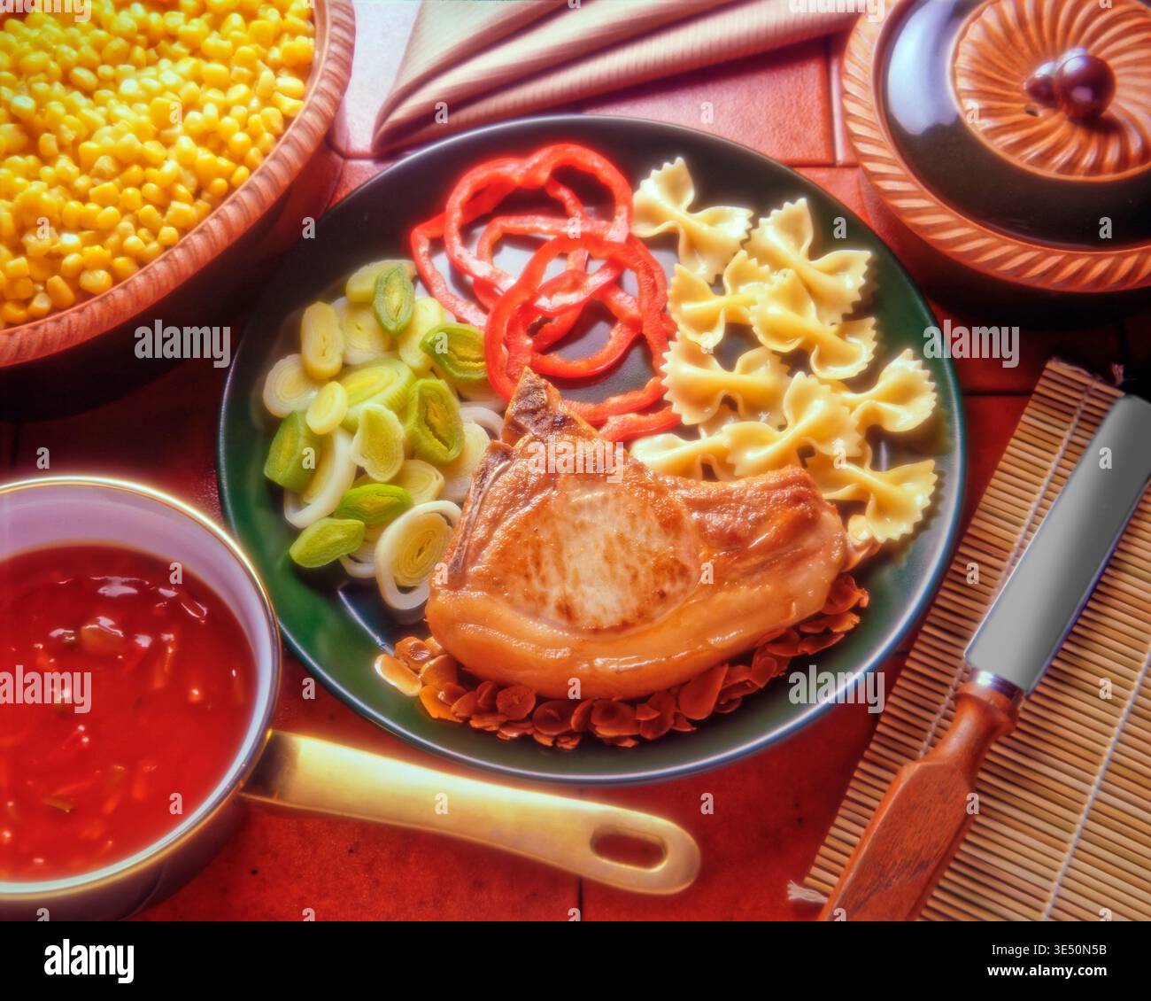 Pork chop serving suggestion. Stock Photo