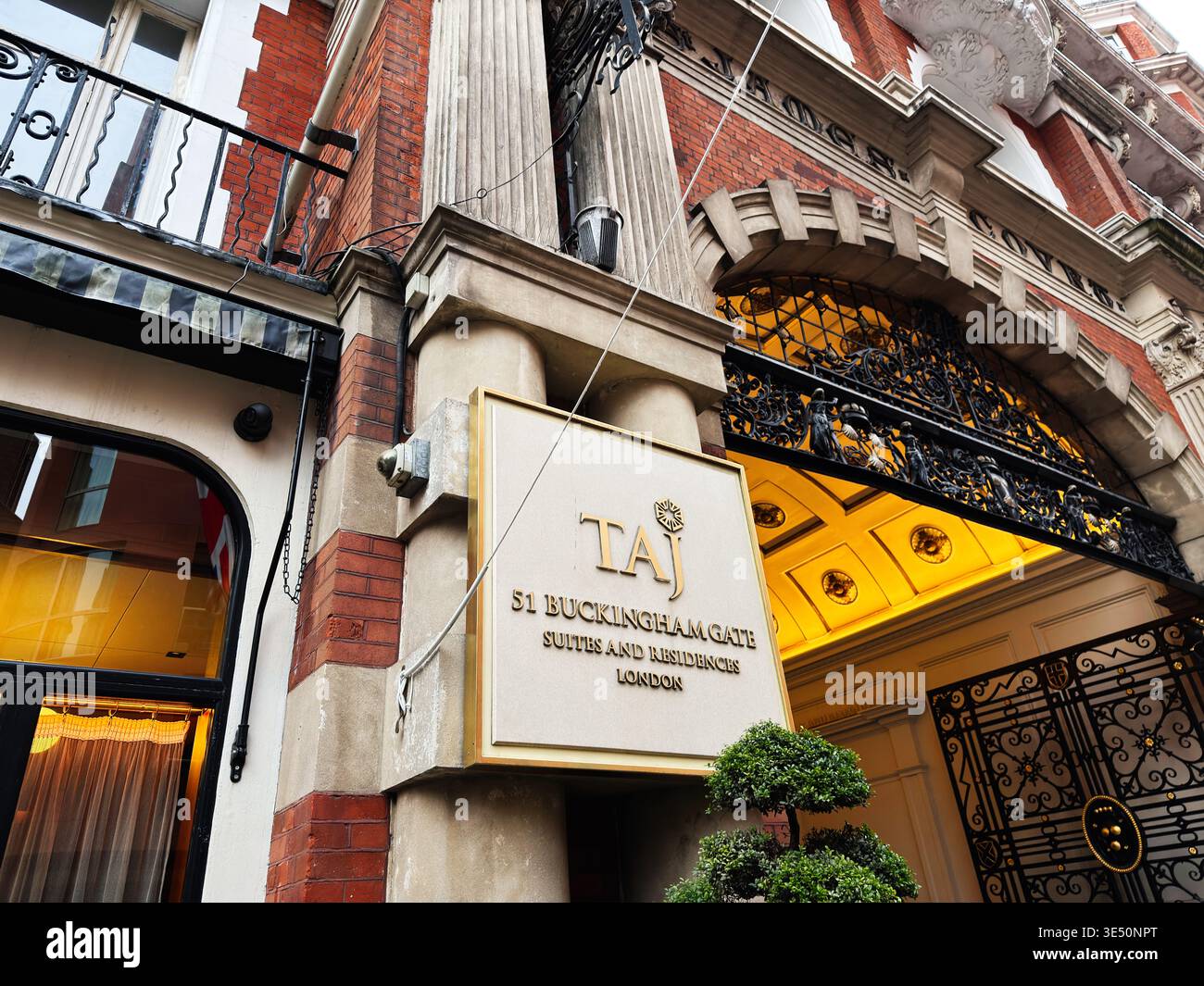 Taj Sign London, UK - February 01, 2026: Ornate entrance and sign for Taj 51 ...