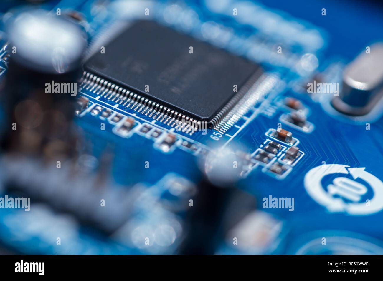 Motherboard with chips, processor and transistors, close-up. Computer and hardware Stock Photo