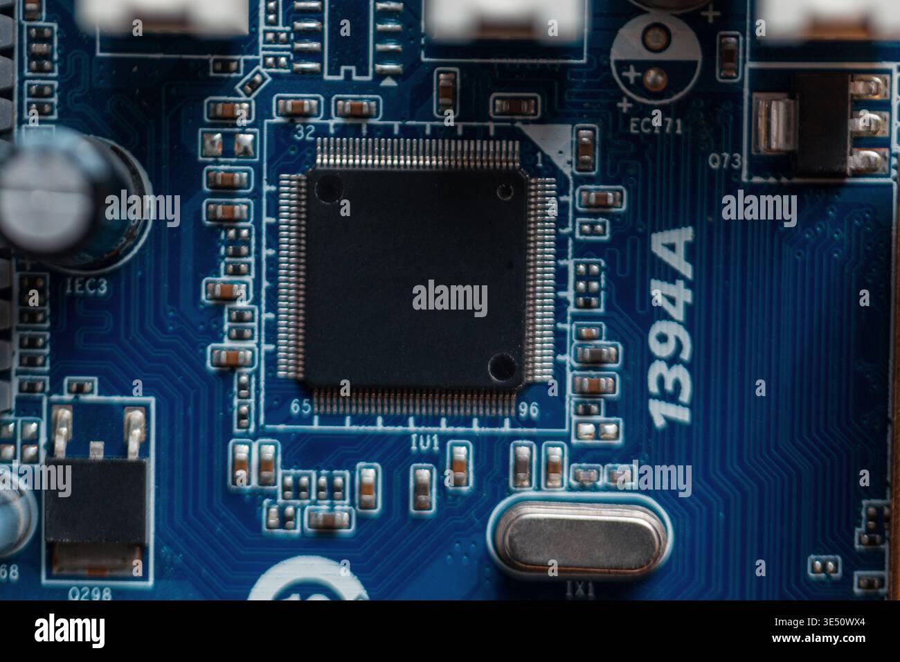 Chip on a blue motherboard. Computer hardware and processor Stock Photo