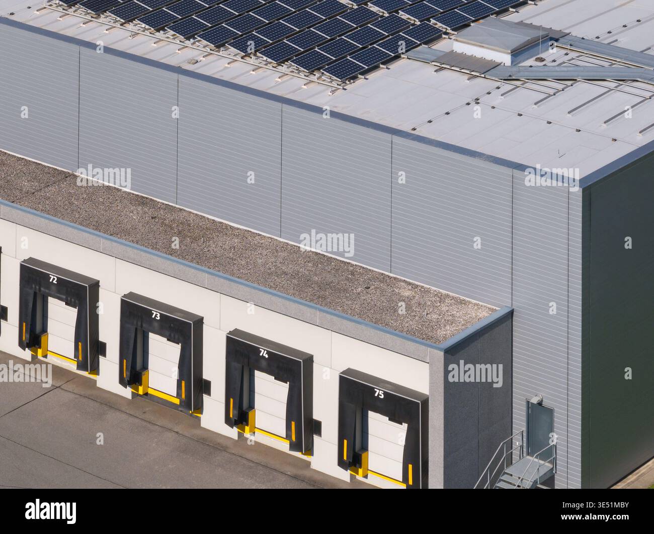 Drone view shows a logistics center with multiple warehouses and ...