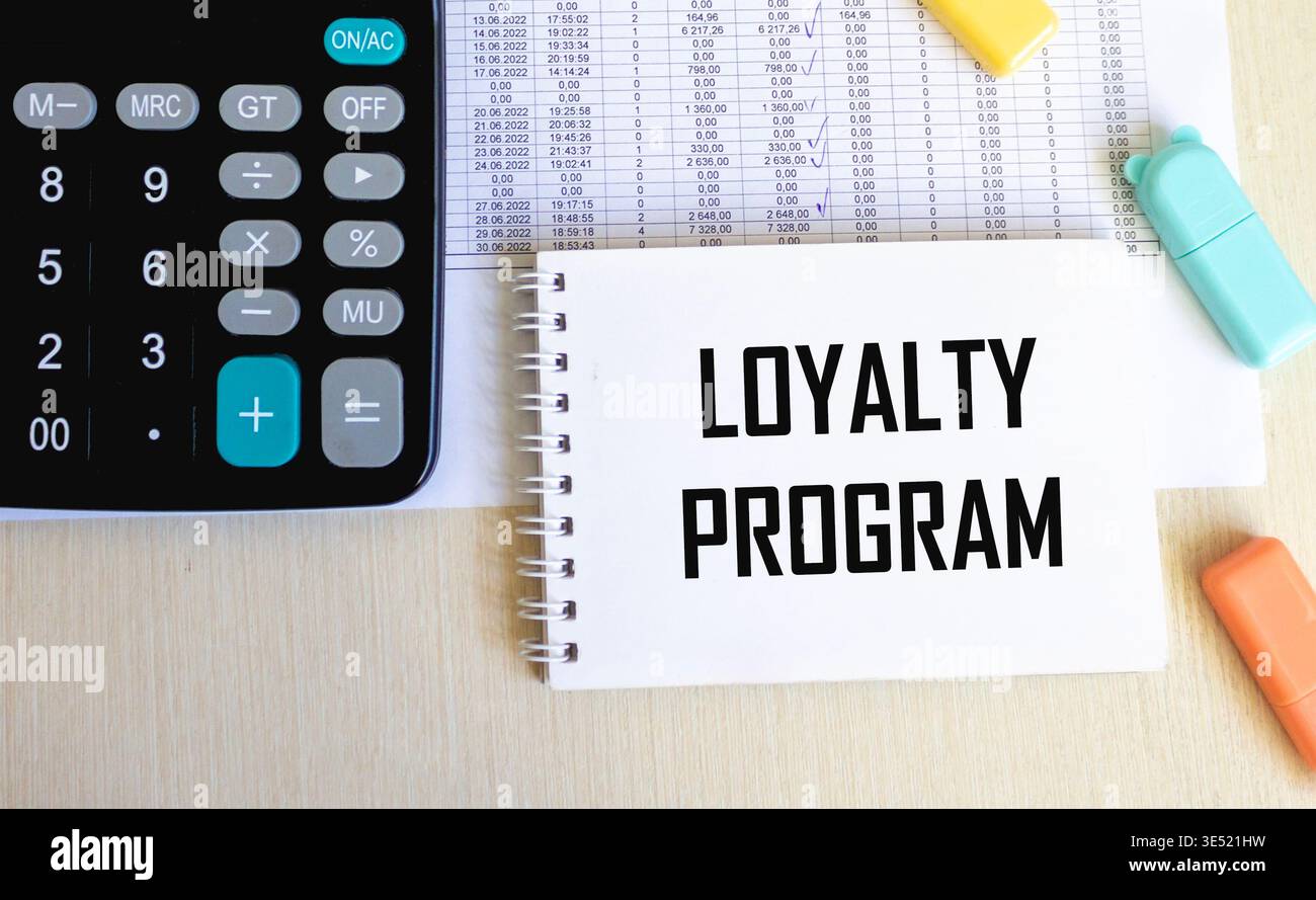 Loyalty Program text on a notepad on chart with keyboard and calculator. Stock Photo