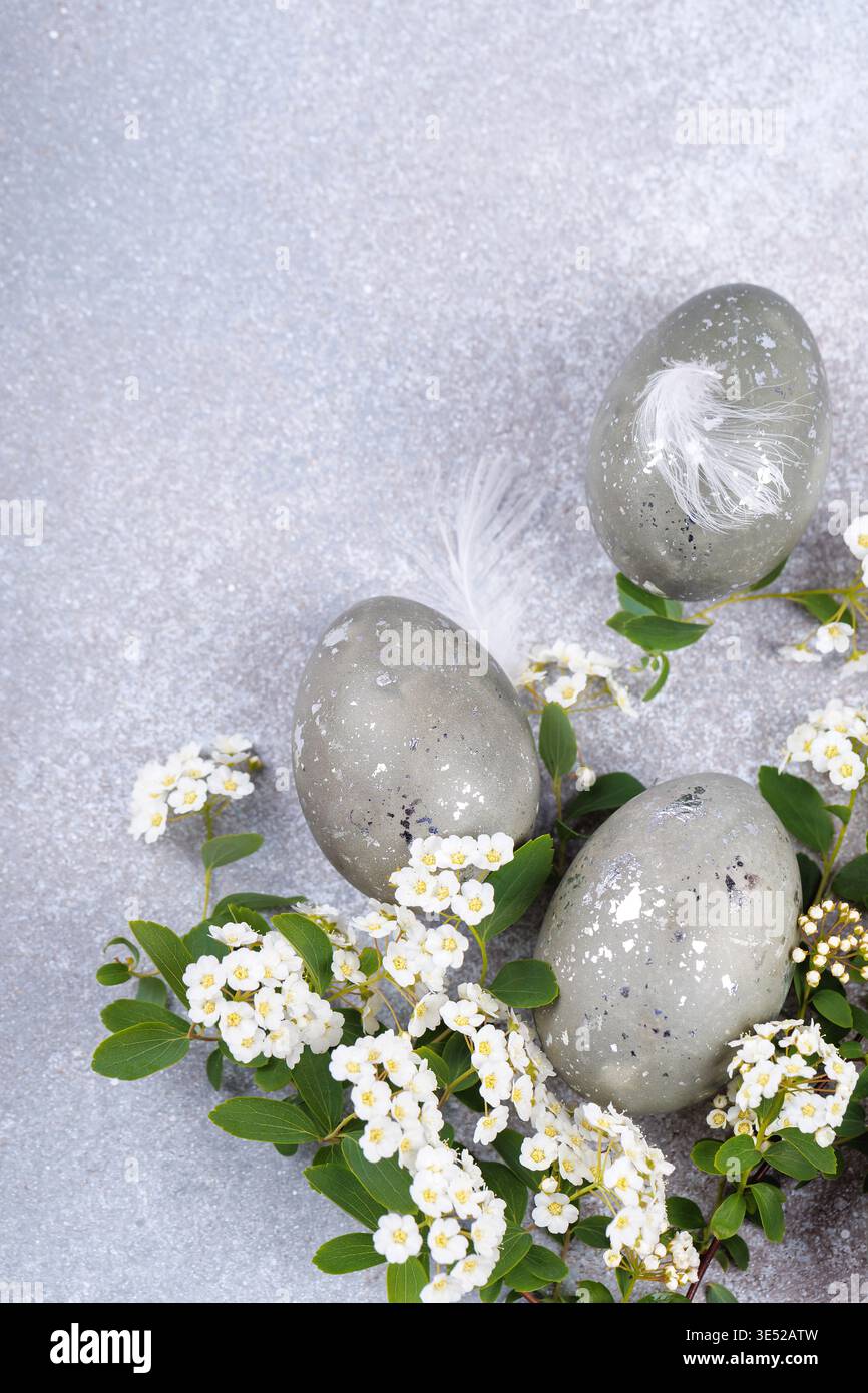 Decorative easter eggs with white flowers spring composition Stock Photo