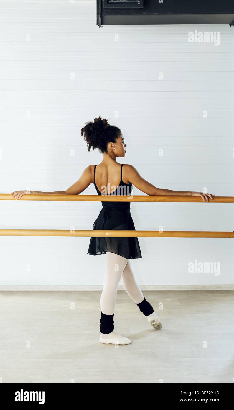Ballet dancer practicing moves in studio Stock Photo