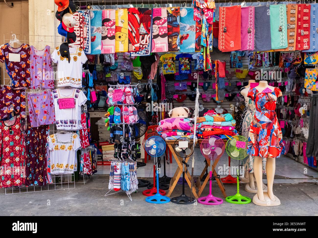 Street scene in Mérida Centro with a small store showcasing colorful merchandise. Stock Photo